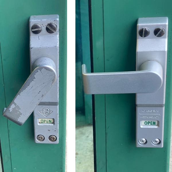 Broken commercial-grade Adams Rite deadlock lever with indicator replaced with new model.