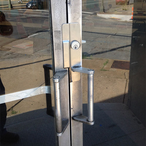 latch guard installed on a commercial door latch guard installed on a commercial door