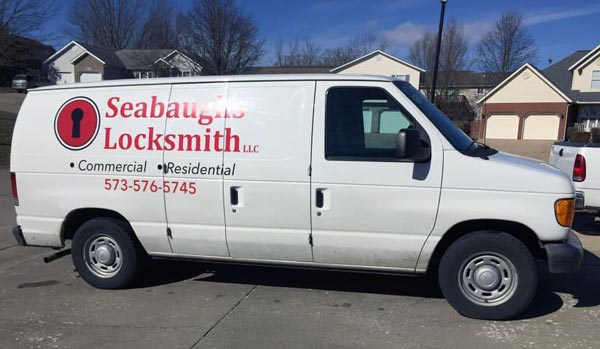 Photo of the Seabaughs locksmith van on a residential service call. Photo of the Seabaughs locksmith van on a residential service call.